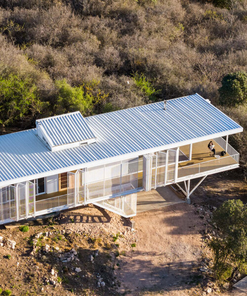 zayat arquitectura encases 'house in the clouds' with perforated panels in argentina