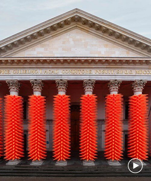 SpY wraps neoclassical columns in ghent with 1984 luminous traffic cones for lichtfestival