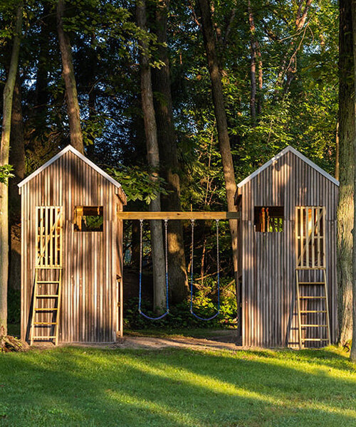 upcycled twin treehouses by temescal creative rise 14 feet high amid a lakeside forest